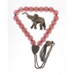 Victorian silver pink glass chain and a silver marcasite elephant brooch, the chain 16cm in