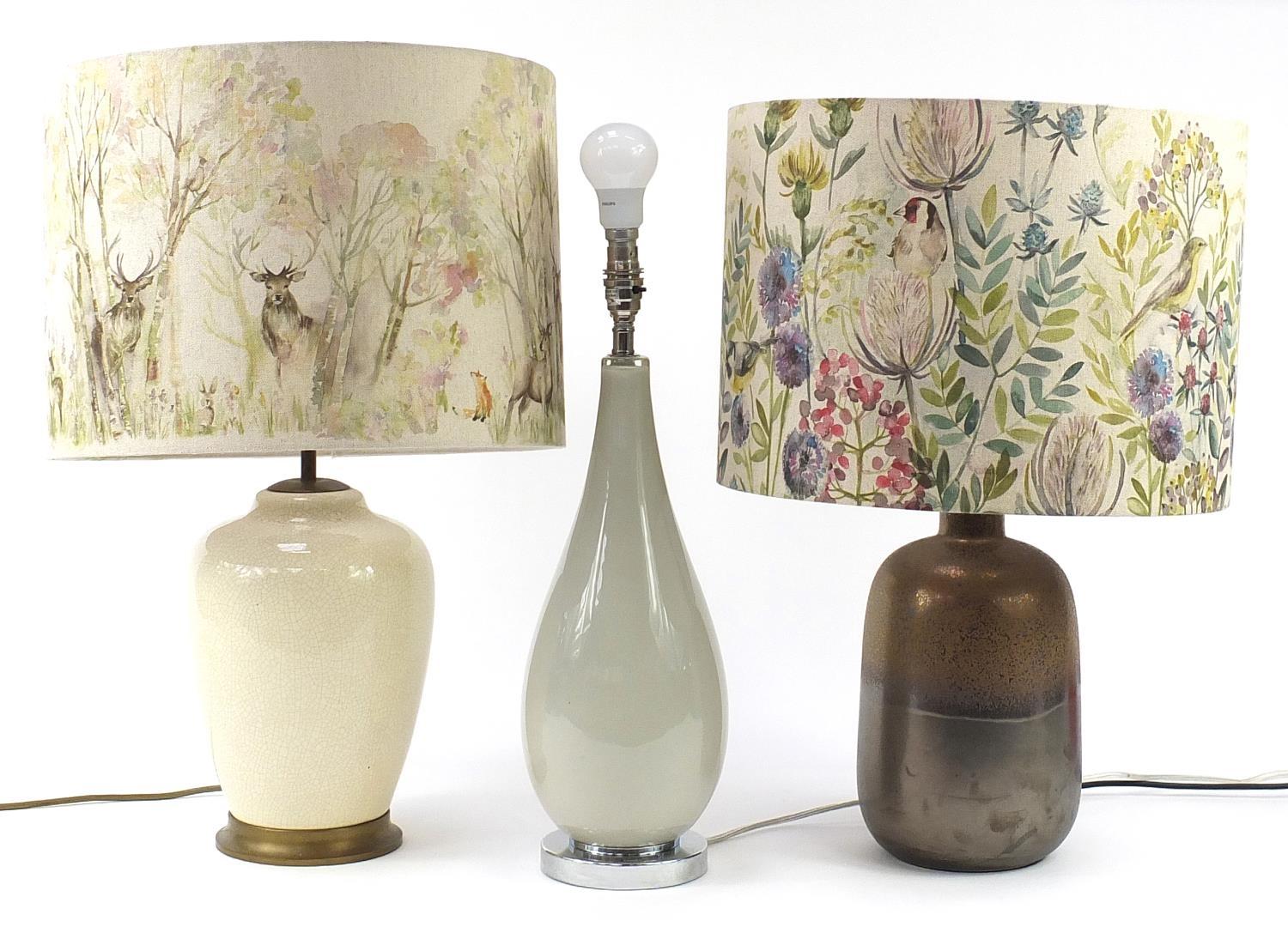 Three contemporary table lamps, two with shades including Laura Ashley, the largest 64cm high