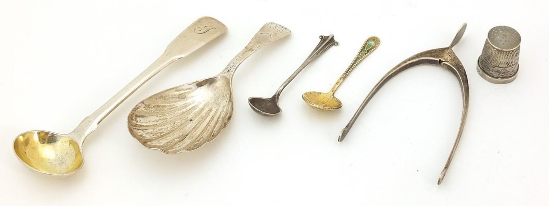 Georgian and later silver objects including a Georgian shell shaped caddy spoon, pair of wishbone