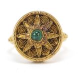 Continental 18ct gold ring with ornate setting and band, set with a cabochon green stone, size M,