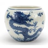 Good Chinese blue and white porcelain jardinière hand painted with dragons chasing a flaming pearl