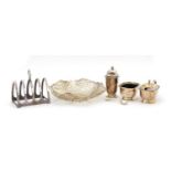 Silver items comprising Garrard & Co three piece cruet, Viner's four slice toast rack and a
