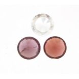 Three gemstones, comprising red spinel, zircon and garnet, each approximately 5.2mm in diameter x