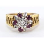 18ct gold diamond and ruby flower head ring, size N, 6.8g