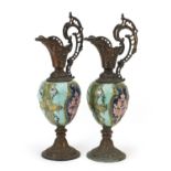 Pair of Continental Maiolica and bronzed mounted ewers, each 52cm high