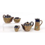 Doulton Slater's stoneware including two teapots and a jug, the largest 18cm high