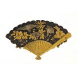 Japanese Shakudo fan brooch decorated in relief with storks amongst flowers, 5cm wide, 14.0g