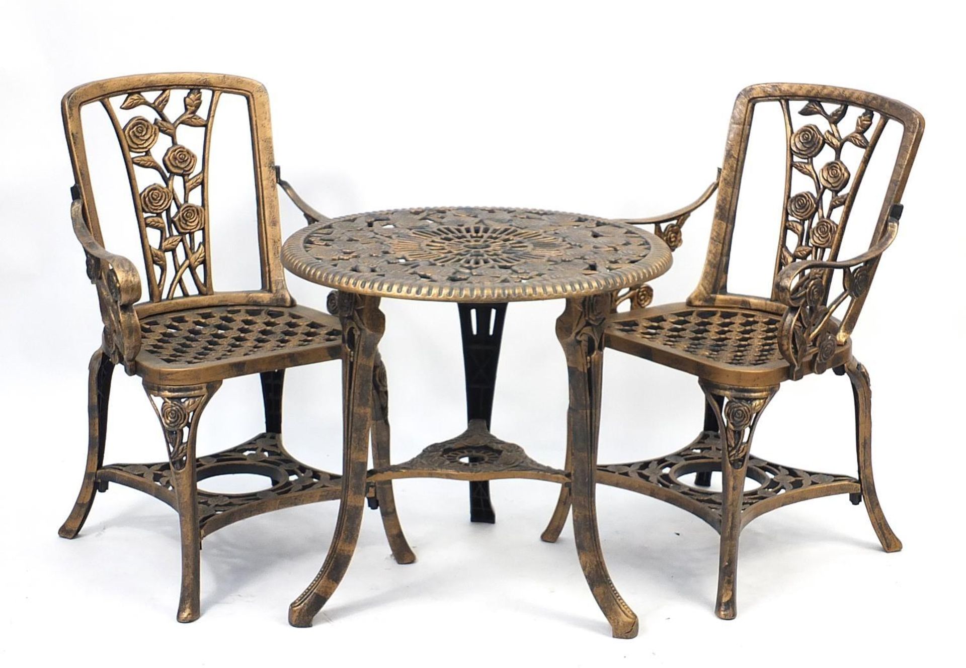 Gold flecked plastic garden table and two chairs, the table 65cm high x 68cm in diameter