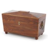 Victorian rosewood sarcophagus shaped tea caddy with lion mask handles, lidded compartments and