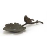 Patinated bronze dish in the form of a bird on a branch, 24cm in length