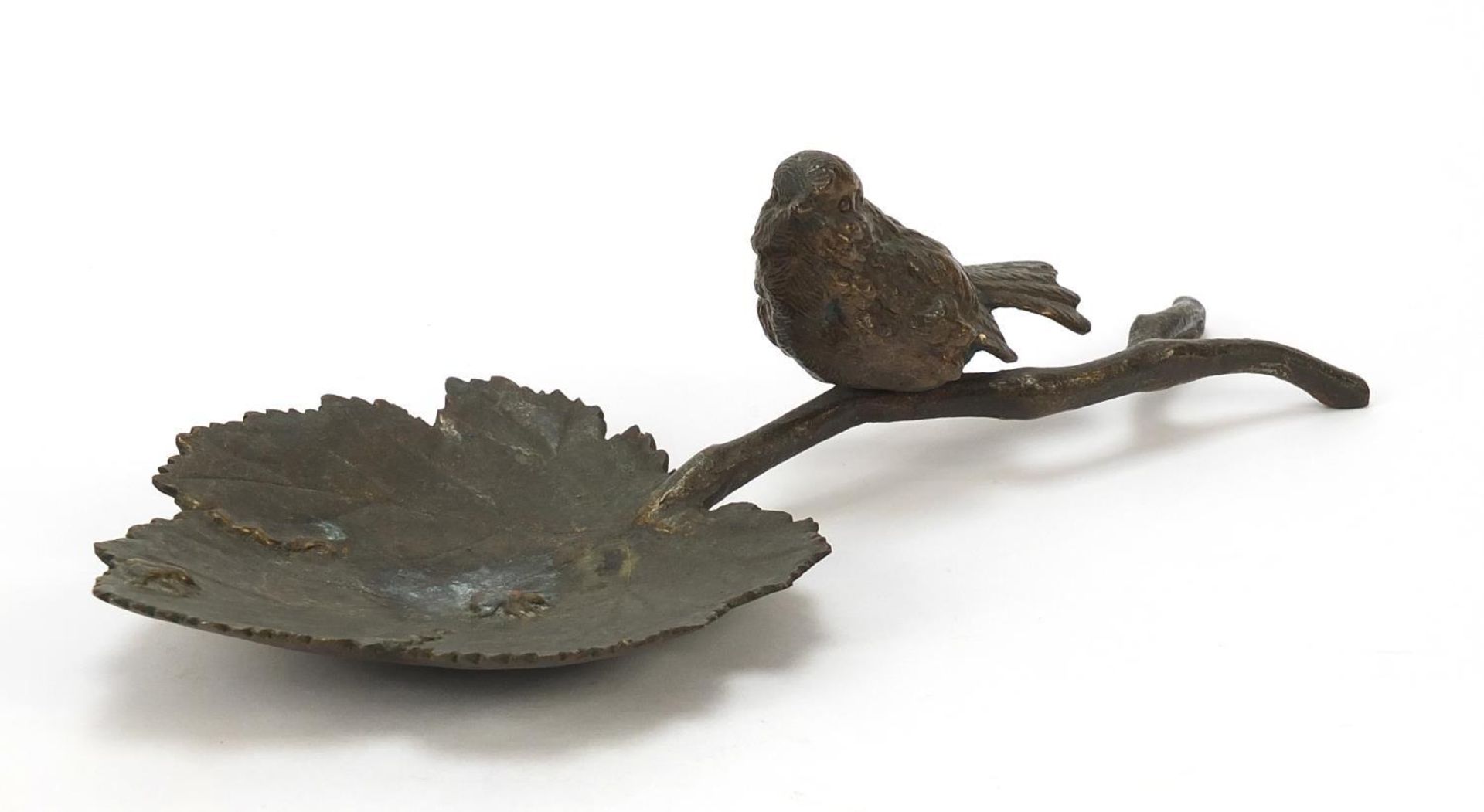Patinated bronze dish in the form of a bird on a branch, 24cm in length