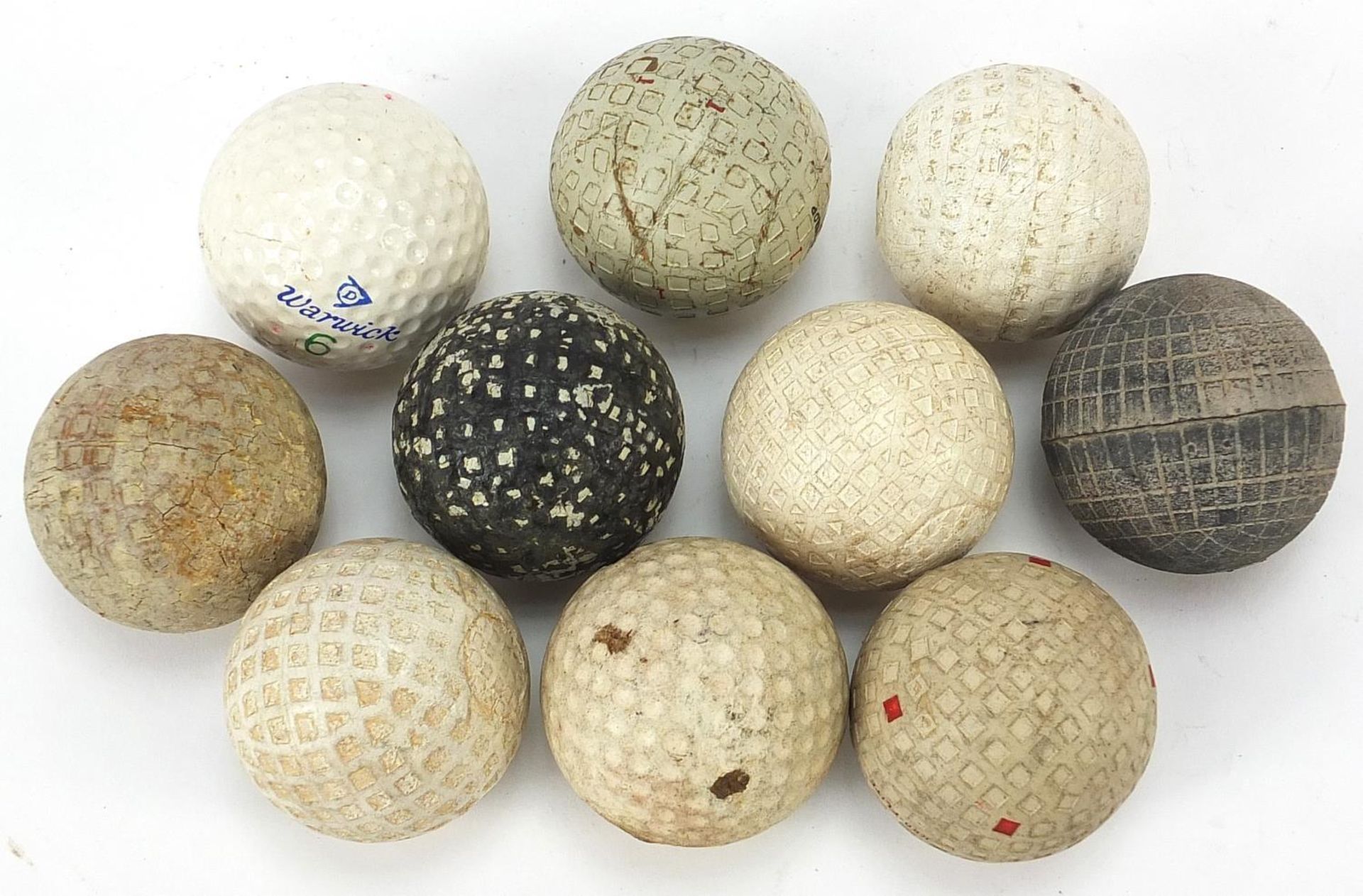 Ten Vintage golf balls including Warwick