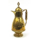 Large 19th century brass catholic holy communion ewer, 57cm high