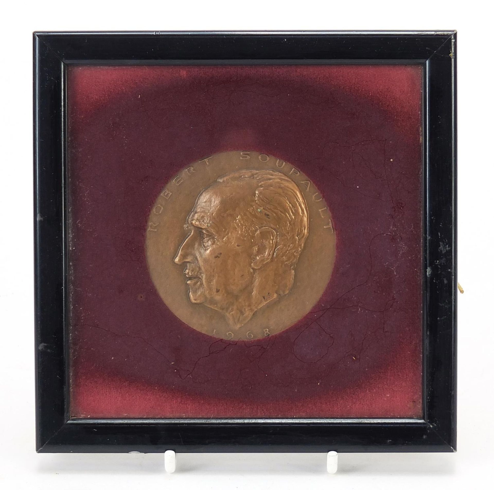Robert Soupault commemorative bronze medallion housed in a glazed frame, dated 1968 and Antony