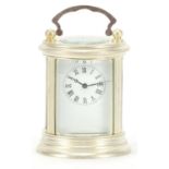 Circular silver plated carriage clock with Roman numerals, 7cm high :