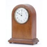 Line inlaid mahogany dome top mantle clock with enamel dial retailed by Pearsons of Eastbourne, 23cm