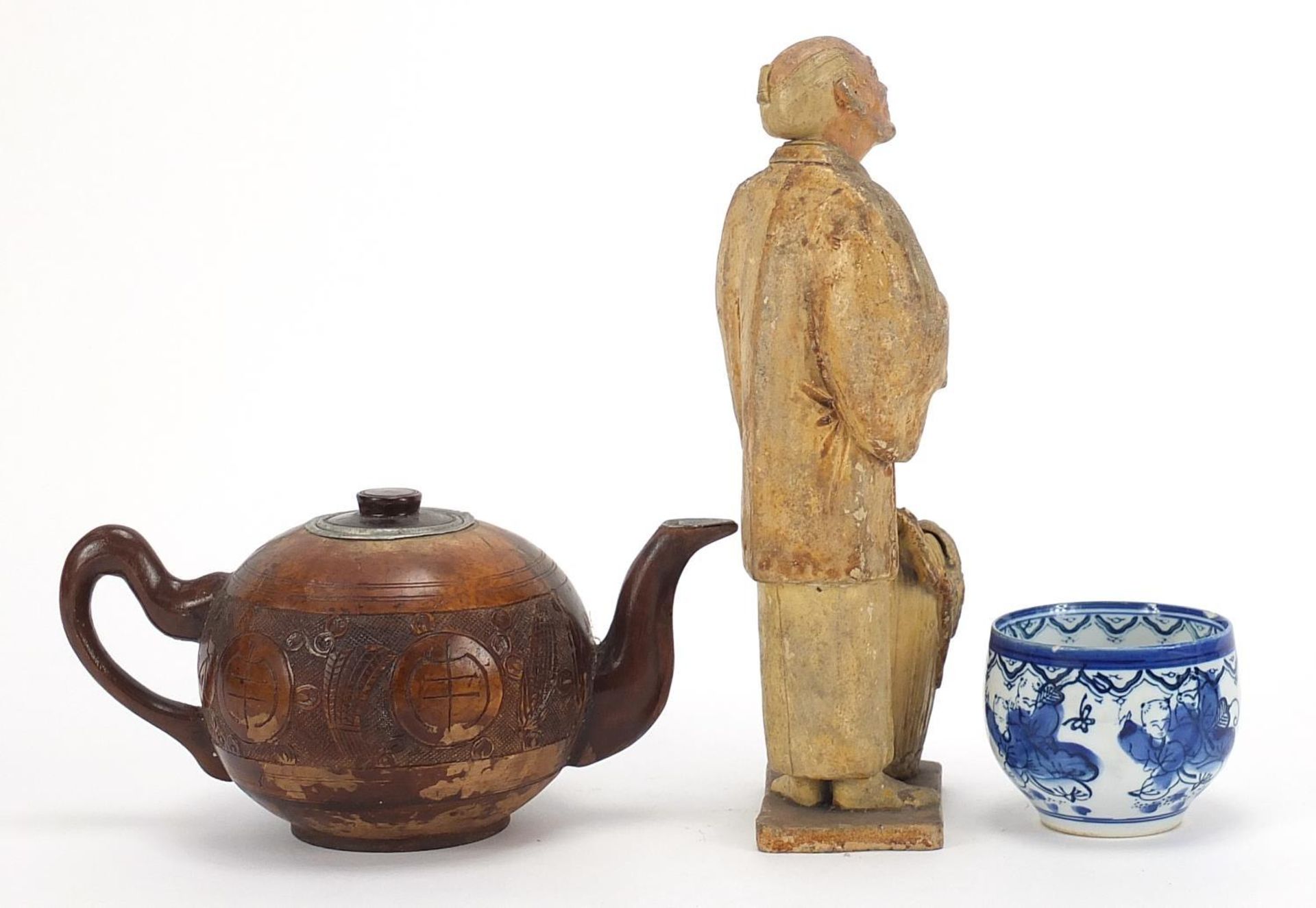 Oriental objects including a carved wood teapot and pottery figure of a man holding a peach, the - Image 5 of 9