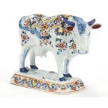 ** WITHDRAWN * * Antique Dutch Delft cow hand painted with flowers, 22cm in length :