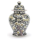 Chinese porcelain baluster vase and cover hand painted with prunus flowers, 27.5cm high :