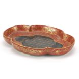 Chinese porcelain four footed iron red and turquoise ground quatrefoil dish, gilded with calligraphy