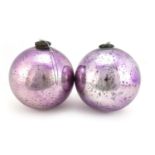 Pair of large Victorian mirrored mauve glass witches balls, each approximately 25cm in diameter :