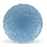 Chinese porcelain footed dish having a clair de lune type glaze decorated in low relief under