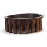 African carved hardwood nupe design twenty legged bowl, 30cm in diameter :