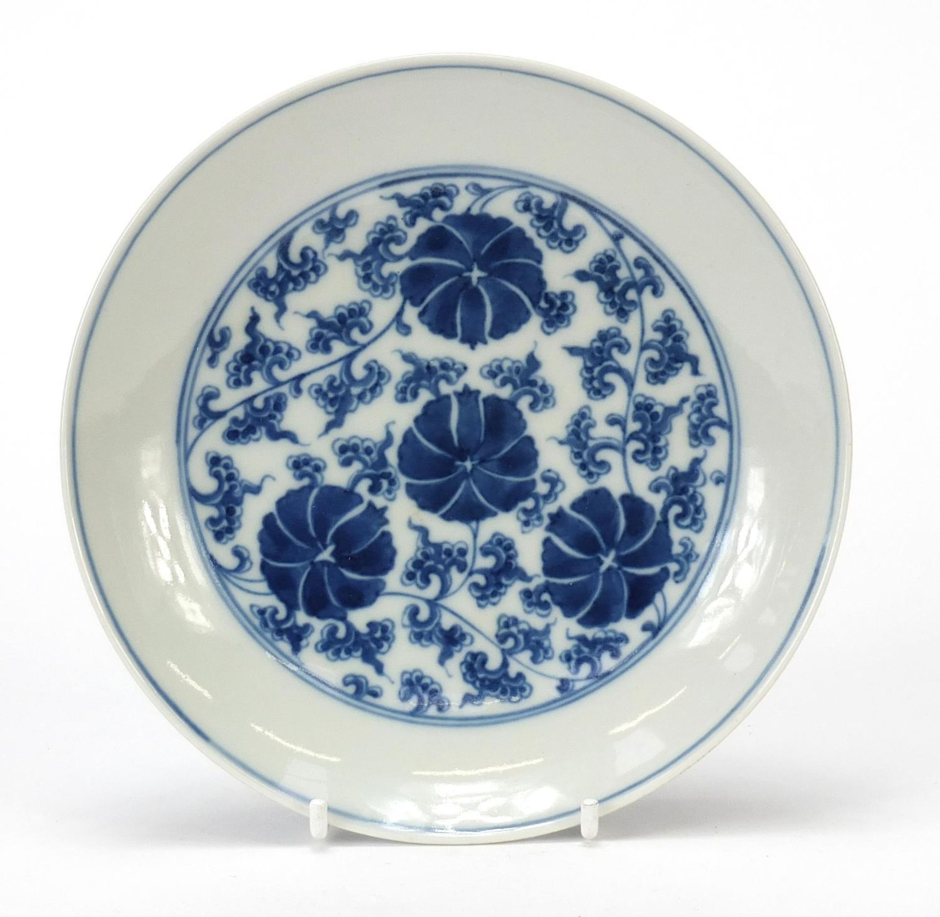 Chinese blue and white porcelain shallow dish hand painted with flower heads and scrolling