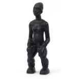 Tribal interest patinated bronze figure of a nude tribeswoman, 36cm high :