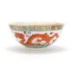 Chinese porcelain bowl hand painted in the famille rose palette with a dragon and phoenix chasing