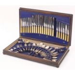 Oak twelve place canteen of silver plated cutlery, the canteen 65.5cm wide (one knife missing) :