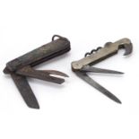 Two military interest folding pocket multi tools including one with corkscrew and Sheffield steel