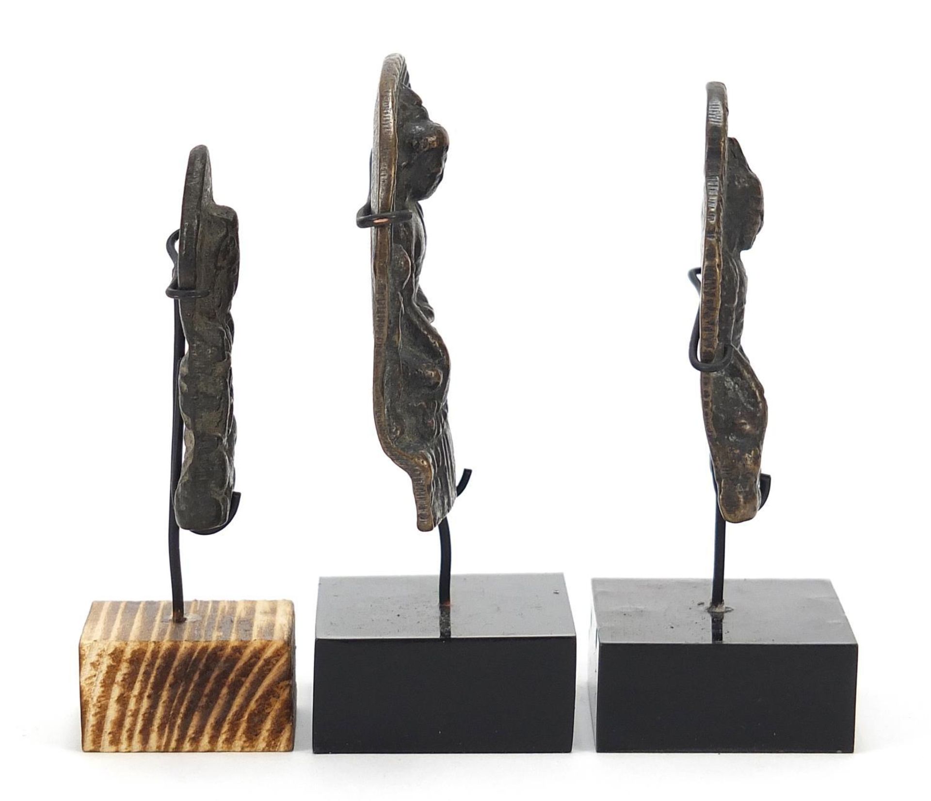 Three Nepalese patinated bronze plaques of Buddha with display stands, the largest 11cm high : - Image 7 of 10