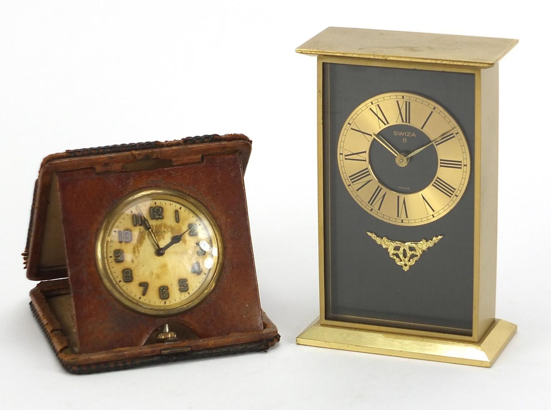 Swiza eight day desk clock and a leather cased travel clock, the largest 14.5cm high :