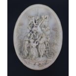 White marble style oval plaque decorated in relief with Christ falling from the cross, inset