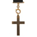 9ct gold cross pendant on a 9ct gold and silk ribbon with swivel clasp, 17cm in length, the cross