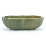 Chinese green jade bowl carved with calligraphy, six figure character marks to the base, 16cm wide :
