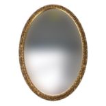 Ornate gilt framed bevel edged wall mirror, 66cm x 45cm :