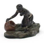 Austrian cold painted bronze of a semi nude African female collecting water, 13.5cm wide :