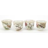 Set of four Chinese porcelain teacups, each hand painted in the famille rose palette with a bird,