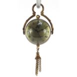 Globular glass and brass fob watch with tassel, 8cm high :