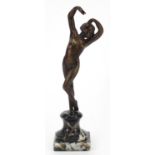 Art Deco style bronzed figurine of a nude female raised on a marble base, 22.5cm high :