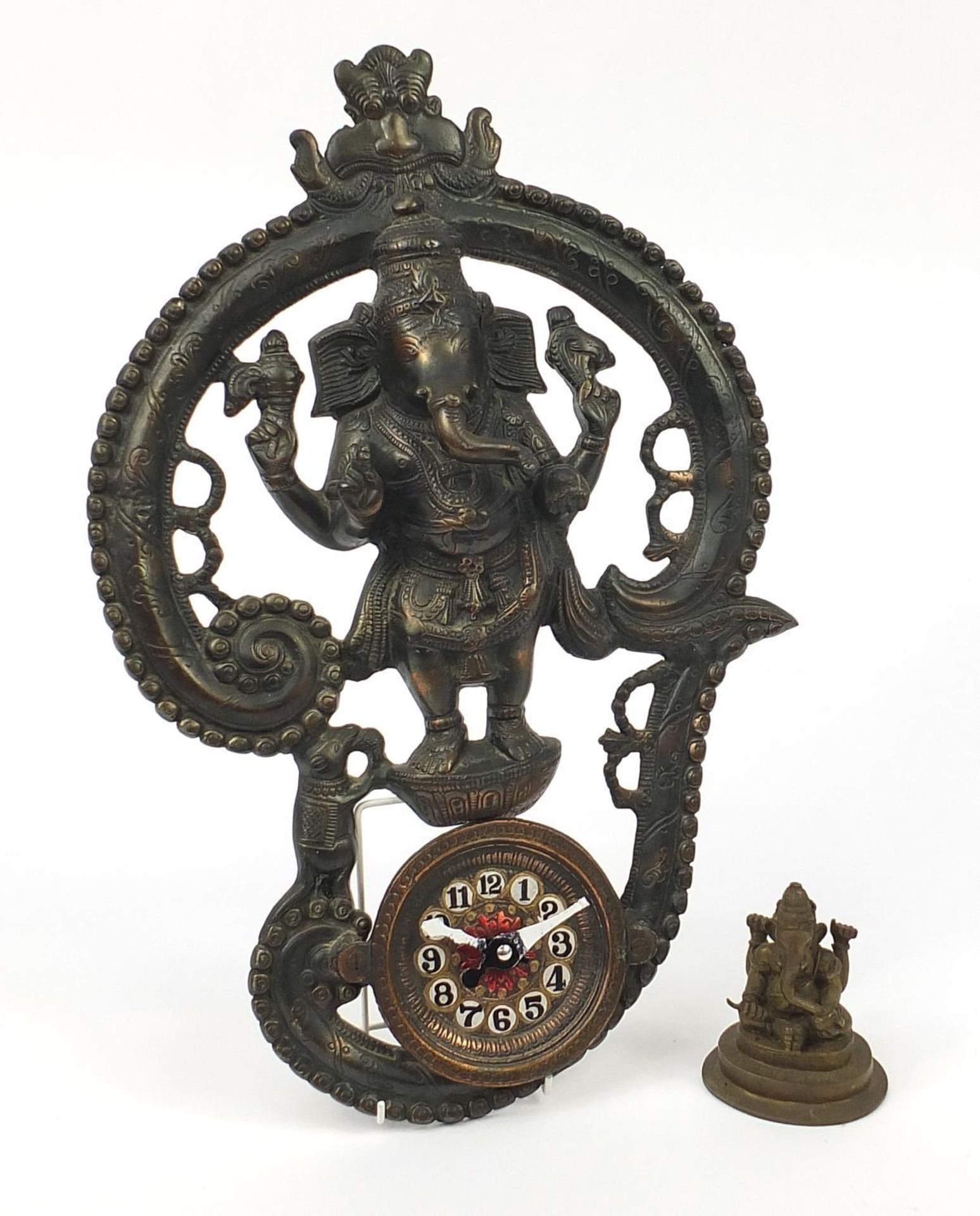 Indian bronze figure of Ganesh and a bronzed metal wall clock, the largest 50cm high :