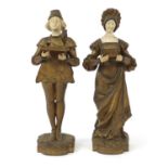 Pair of gilt metal and alabaster figures of a boy and girl in dutch dress, the largest 28.5cm high :