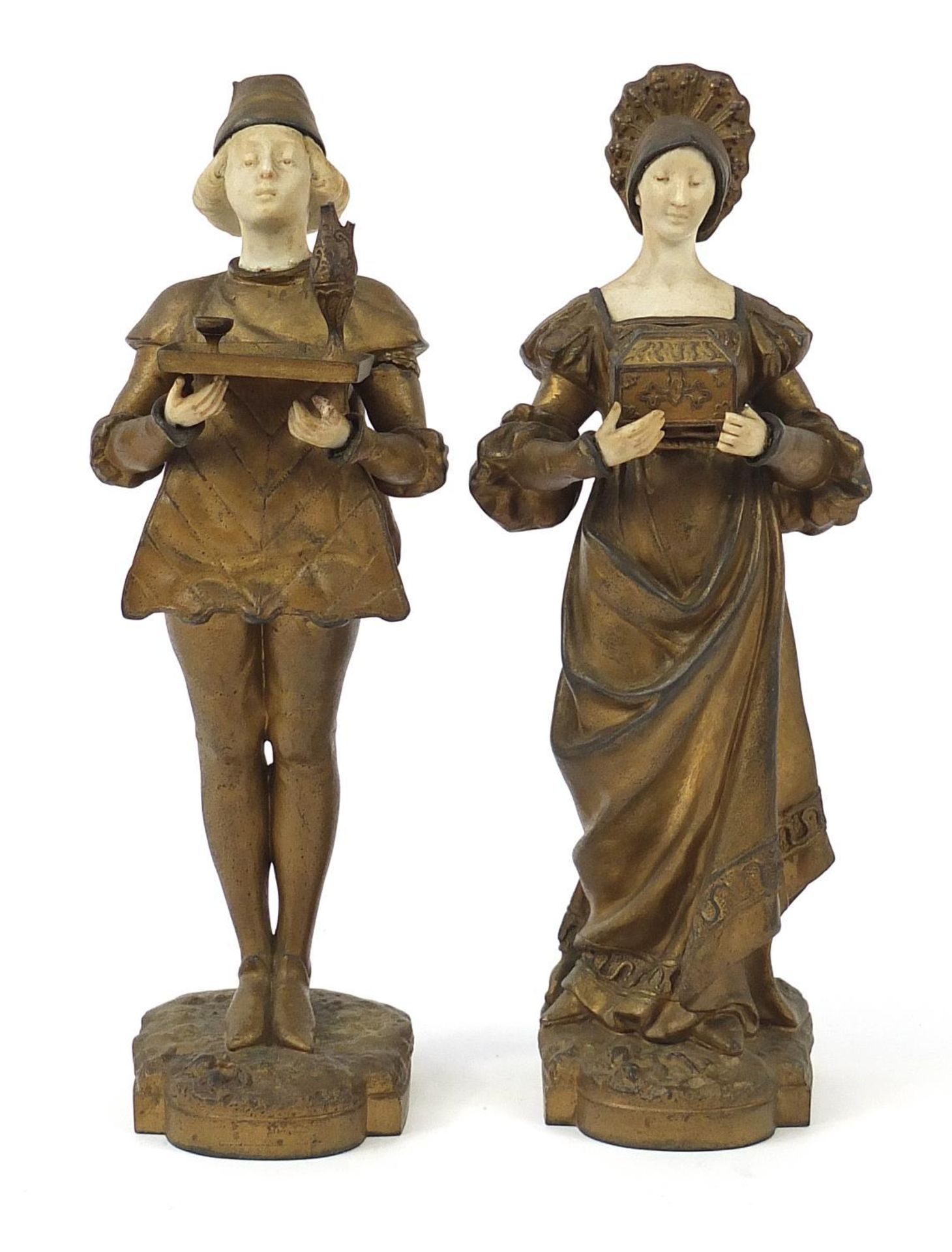 Pair of gilt metal and alabaster figures of a boy and girl in dutch dress, the largest 28.5cm high :