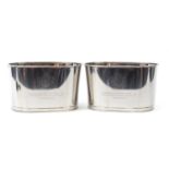 Pair of large Champagne ice buckets with Lily Bollinger mottos, each 26cm H x 43cm W x 29cm D :