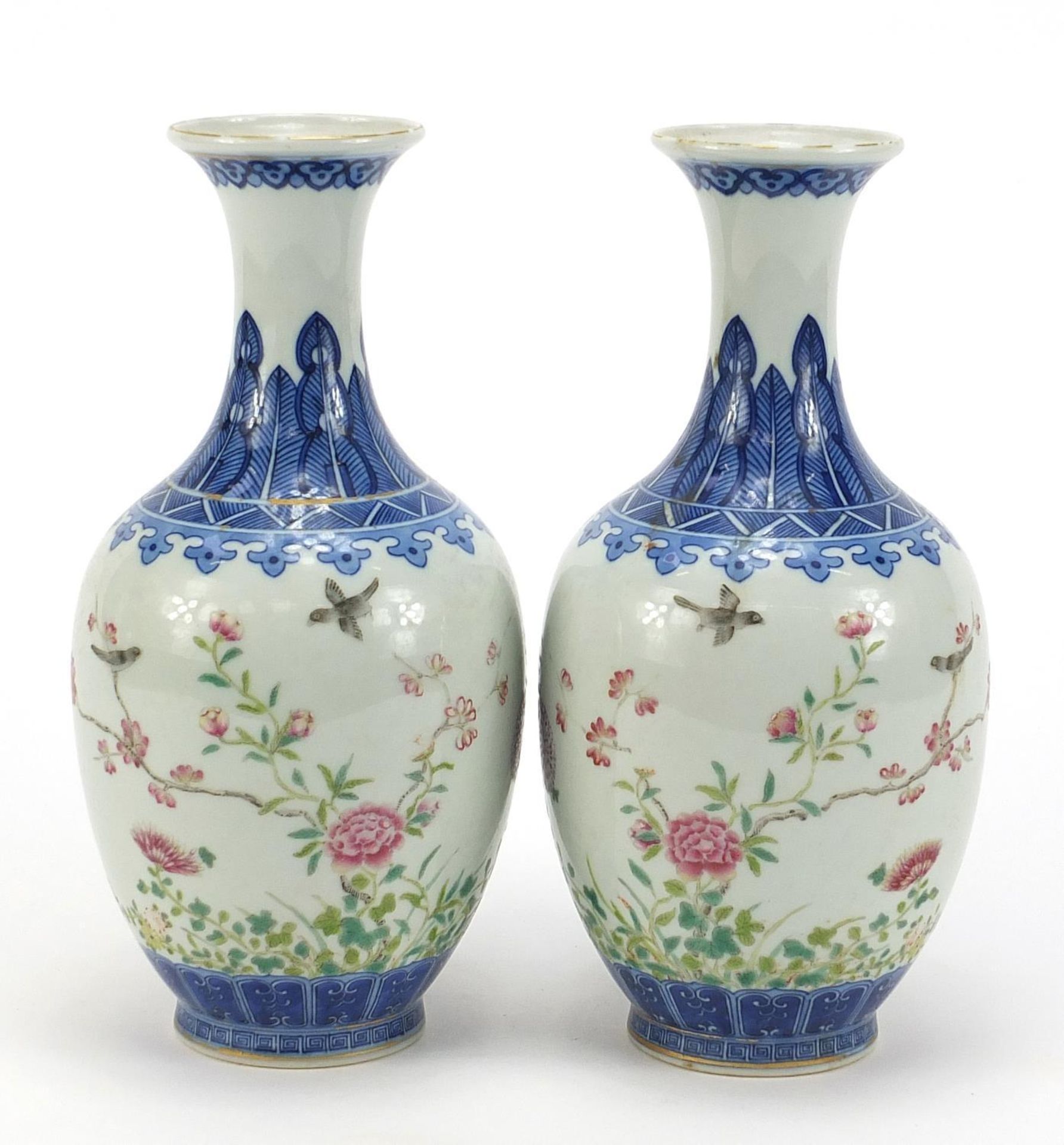 Pair of Chinese blue and white porcelain vases hand painted in the famille rose palette with birds