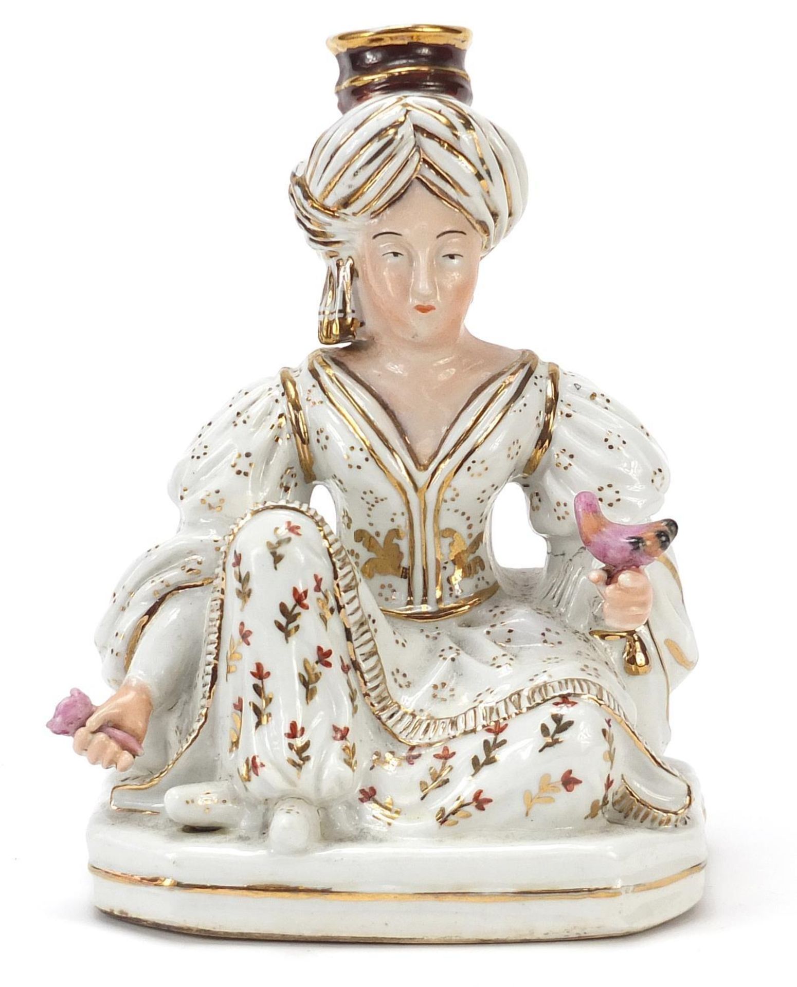 Jacob Petit, French porcelain figural candlestick of a Turkish female holding a bird and flower,