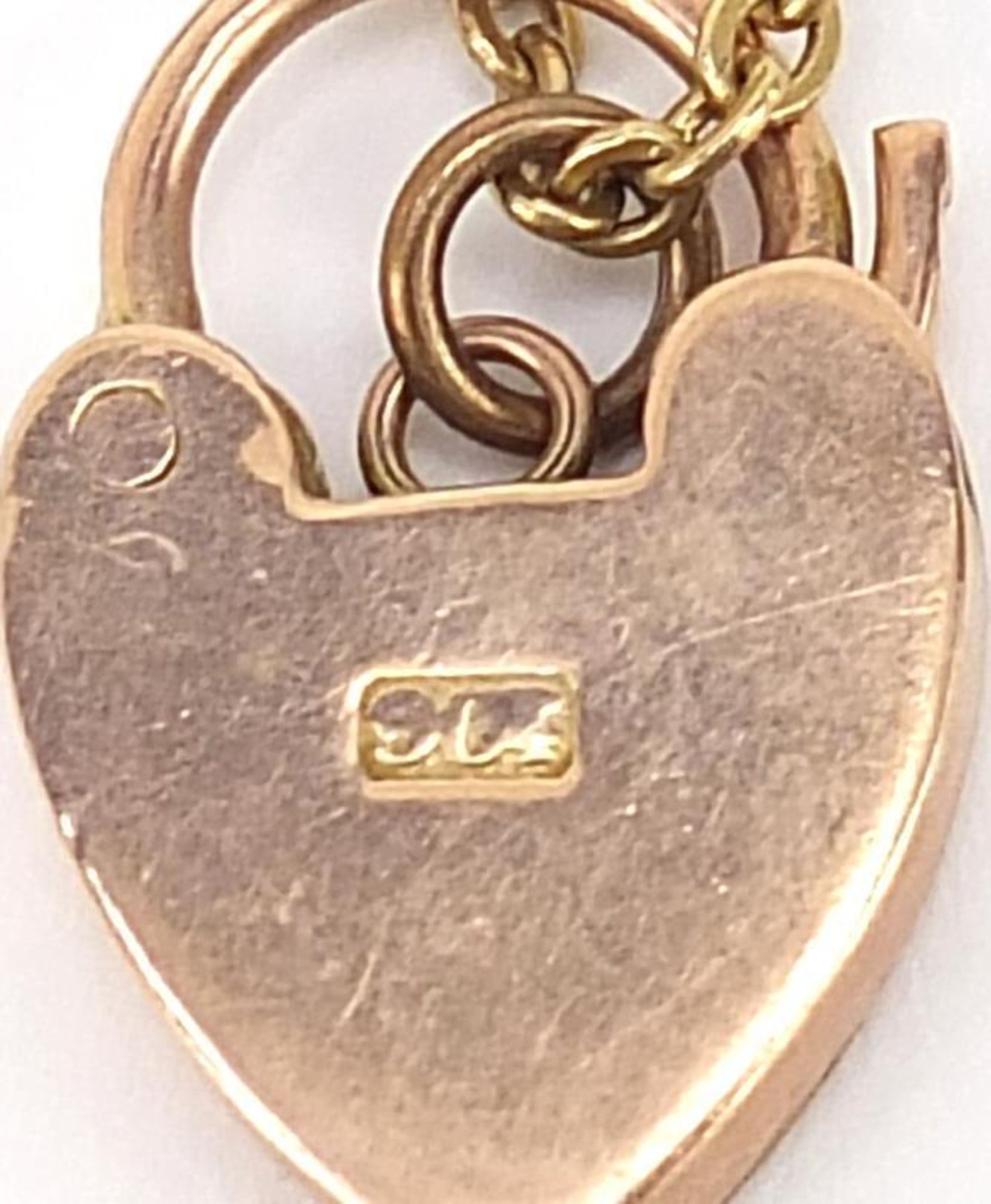 Unmarked gold bracelet, (tests as 9ct gold) with a 9ct gold loveheart padlock, 16cm in length, 7. - Image 4 of 4