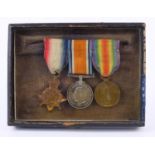 British military World War I trio housed in a glazed display case awarded to Lieutenant H Beeney